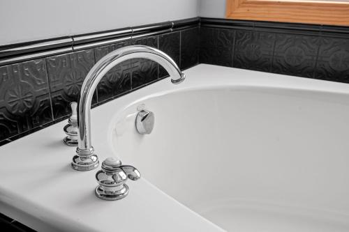 a kitchen sink with a chrome kitchen faucet at Minnetonka Dream in Orono