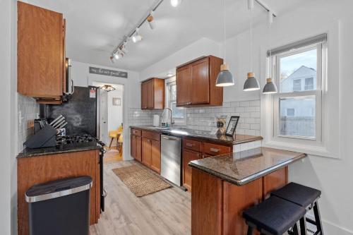 a kitchen with wooden cabinets and a counter top at Richfield Gem in Richfield