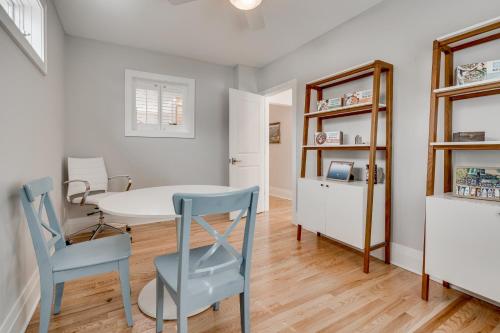 a dining room with a table and two chairs at Lakefront Cottage in Excelsior