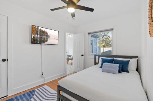 a bedroom with a bed and a ceiling fan at Richfield Gem in Richfield