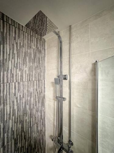 a shower stall in a bathroom with a shower at Pet-Friendly Coastal Home by Adliv in Broadstairs