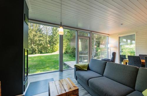 a living room with a couch and a table at 4 Personen mit Sauna F1H5 in Ruhla