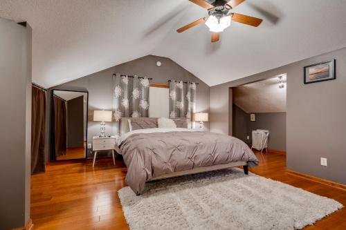 a bedroom with a bed and a ceiling fan at Grand Residence in Saint Paul