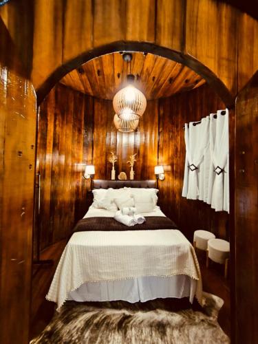 Cama o camas de una habitación en Casa di Pipa com ofurô
