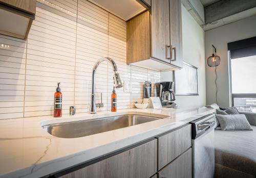 a kitchen with a sink and a counter at Sable 801 - Alcove in Minneapolis