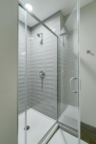a shower with a glass door in a bathroom at Sable 802 - Alcove in Minneapolis