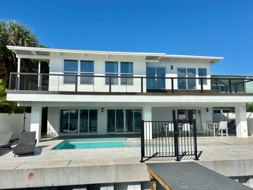 a large white house with a swimming pool at Bayside Grande Villa in Clearwater Beach