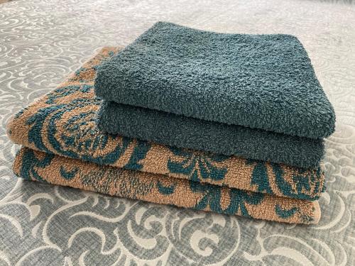 a pile of towels sitting on top of a rug at Casa Anna Capri Charme in Capri
