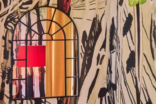 a painting of a window on a building at Beit Tamanna Guesthouse in Beirut