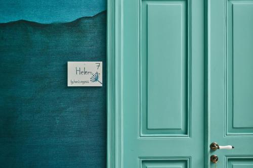 a door with a sign that says hermes on it at Beit Tamanna Guesthouse in Beirut