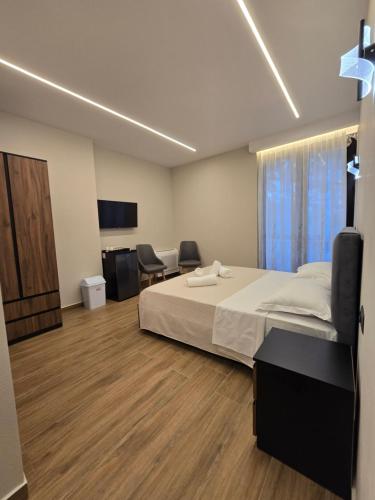 Postel nebo postele na pokoji v ubytování Villa Olympia