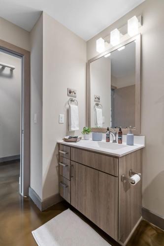 a bathroom with a sink and a mirror at Sable 604 - One Bedroom in Minneapolis