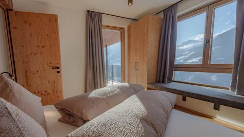 Postel nebo postele na pokoji v ubytování Lahnerhof Chalets
