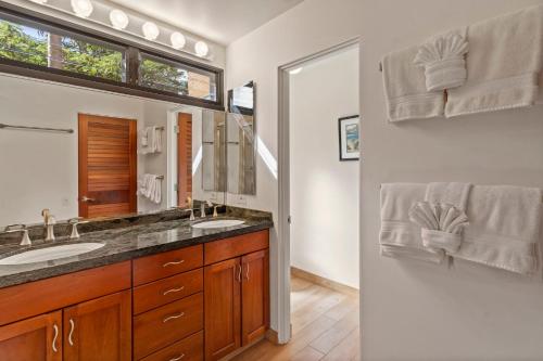 a bathroom with a sink and a mirror at Wailea Elua 2303 by Coldwell Banker Island Vacations in Wailea