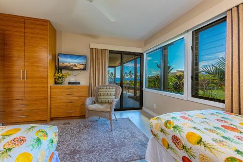 a bedroom with a bed and a view of the ocean at Wailea Elua 2305 by Coldwell Banker Island Vacations in Wailea