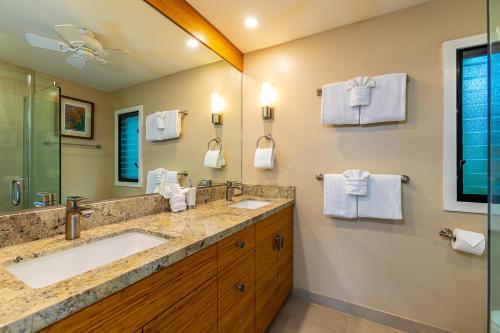 a bathroom with a large sink and a shower at Wailea Elua 2305 by Coldwell Banker Island Vacations in Wailea