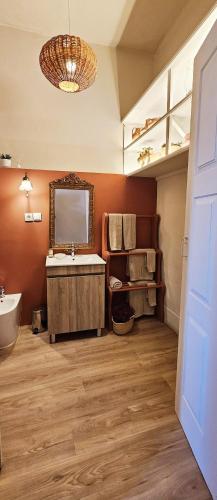 a bathroom with a sink and a mirror at Alma House - Caminha in Caminha