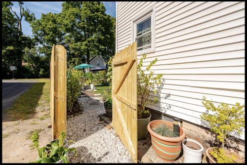 a wooden gate in front of a house at 2 bedroom Apt in Kingston
