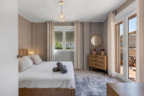 Postel nebo postele na pokoji v ubytování 17 Vistamar Playa Flamenca