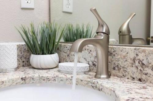 a sink with a faucet in a bathroom at Emerald Island Resort townhouse 3 Bedrooms in Kissimmee