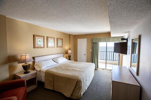 En eller flere senge i et værelse på Atalaya Towers