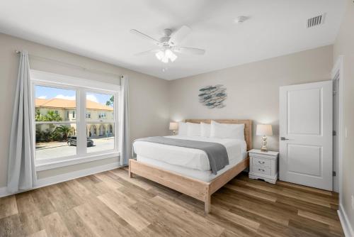 a bedroom with a bed and a window at Beach House - Marina View by Panhandle Getaways in Port Saint Joe