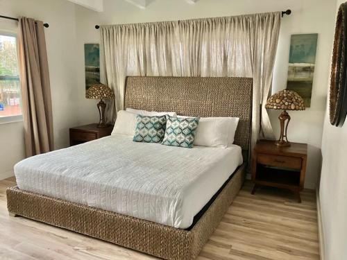 a bedroom with a large bed with two night stands at Bayside Grande Villa in Clearwater Beach