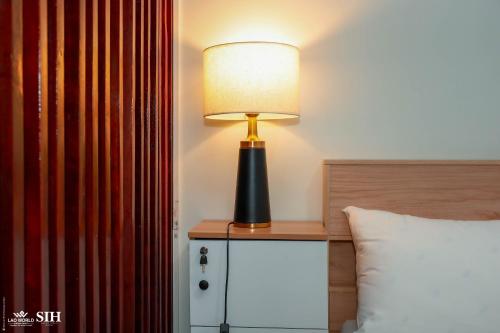 Postel nebo postele na pokoji v ubytování Savan Itecc Hotel