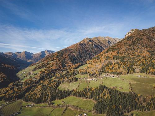 an aerial view of a valley in the mountains at Lahnerhof Chalets in Lutago