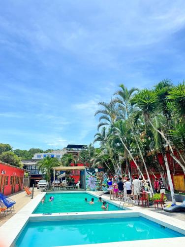 a pool at a resort with people playing in it at Hotel Montañita in Montañita
