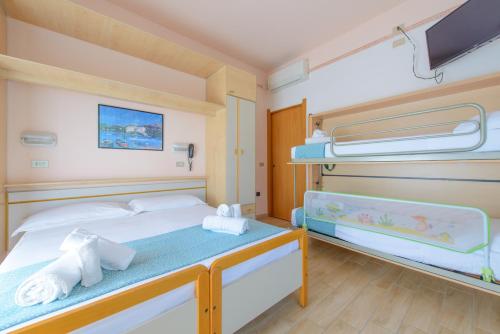 Postel nebo postele na pokoji v ubytování Hotel Colorado