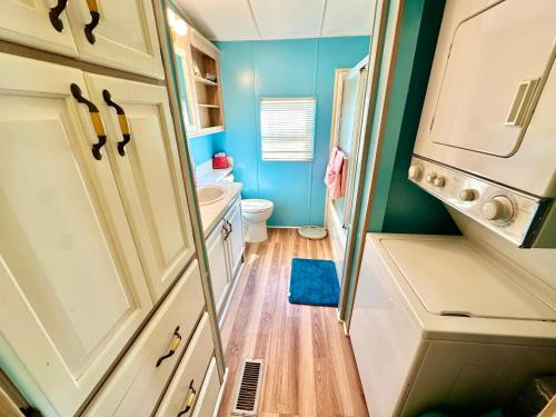 a small bathroom with a toilet and a sink at Beachfront Bliss N1026 in Jensen Beach