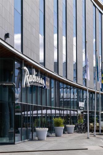 a building with a sign on the front of it at Radisson Blu Hotel Uppsala in Uppsala