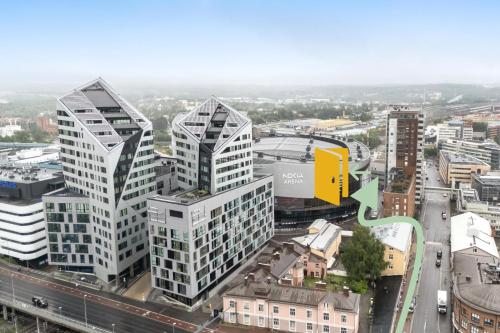 an aerial view of a city with tall buildings at Wallesmanni - Nokia Arena prime location apartments by Come in! in Tampere