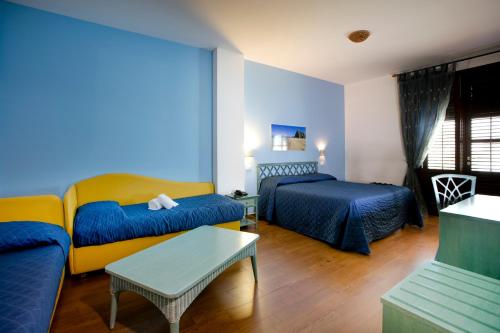 Cama o camas de una habitación en Agave Superior Rooms
