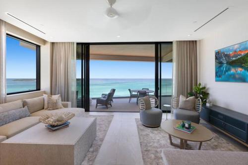 a living room with a view of the ocean at Beachfront 3 bedroom Luxury Residence in Nassau