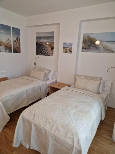 Postel nebo postele na pokoji v ubytování Room 211 - Aparthotel Jadranka