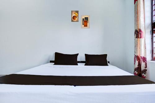 Katil atau katil-katil dalam bilik di Hotel O NRI Guest House