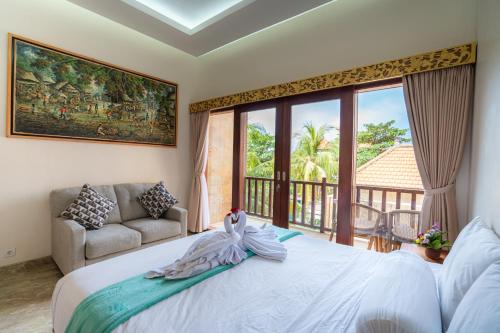 Кровать или кровати в номере Amed Paradise Beach Club