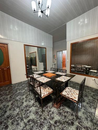 a dining room with a table and chairs at Casa Buen Agüero in San Antonio