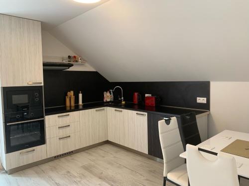 A kitchen or kitchenette at Apartmán Paseky