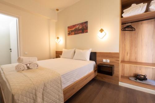 Ένα ή περισσότερα κρεβάτια σε δωμάτιο στο Modern Rooms Exarchia