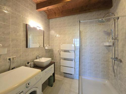a bathroom with a shower and a sink and a mirror at Gîte Authentique Calme avec Piscine et Jardin Privé - FR-1-616-474 in Sainte-Sabine