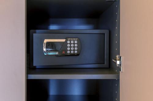 a remote control sitting inside of a blue box at Apartments Bären in Elzach