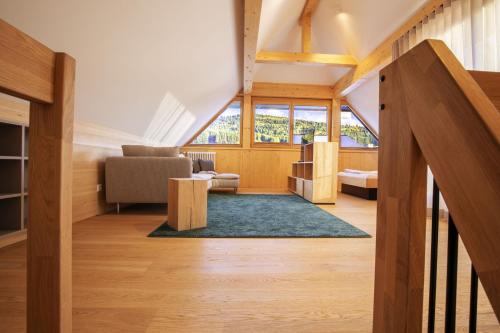a living room with a couch and a chair at Apartments Bären in Elzach