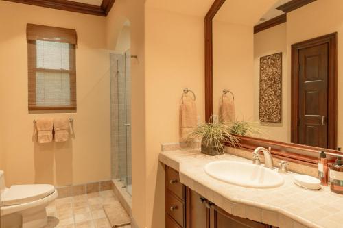 a bathroom with a sink and a toilet and a mirror at CR Luxury Terrazas De Marbella 3A 3 Bdrm in La Mona