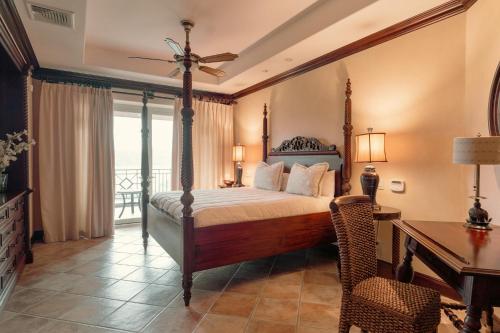 a bedroom with a bed and a desk and a table at CR Luxury Terrazas De Marbella 3A 3 Bdrm in La Mona