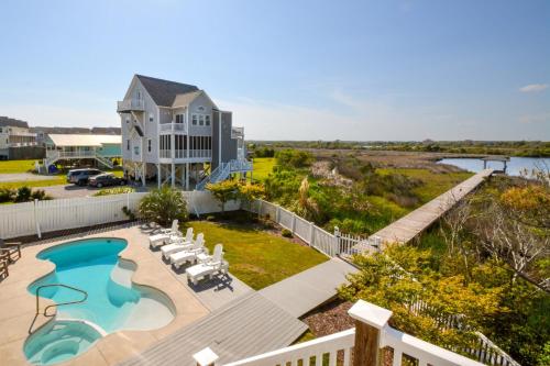 an aerial view of a house with a swimming pool at Sounds Beachy in North Topsail Beach