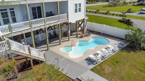 an aerial view of a house with a swimming pool at Sounds Beachy in North Topsail Beach