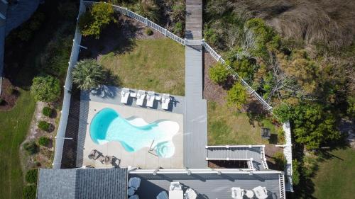 an aerial view of a house with a painting on it at Sounds Beachy in North Topsail Beach